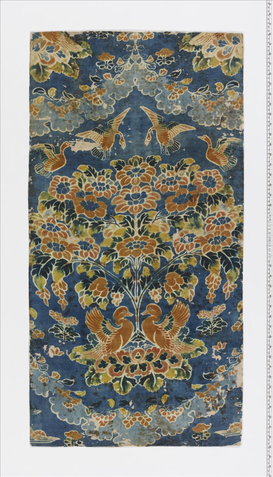 Mat of plain weave silk with design in |kyōkechi| on dark blue 